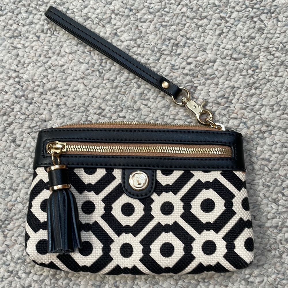 Spartina 449 wristlet with leather trim and two pockets.  geometric pattern